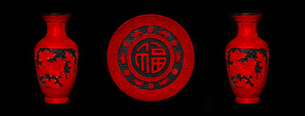 A set of 3 lacquer ware home decoration in rich red and black. Plate in the middle, with the Chinese character 'Fu' which means good luck and wealth.